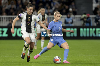2024-02-23 - Eugenie Le Sommer of France, left Lena Oberdorf of Germany during the UEFA Women's Nations League, Semi-final football match between France and Germany on February 23, 2024 at Groupama Stadium in Decines-Charpieu near Lyon, France - FOOTBALL - WOMEN'S NATIONS LEAGUE - FRANCE V GERMANY - UEFA NATIONS LEAGUE - SOCCER