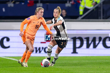2024-02-28 - Wieke Kaptein of the Netherlands battle for possession with Giulia Gwinn of Germany during the UEFA Women's Nations League, third place football match between Netherlands and Germany on February 28, 2024 at Abe Lenstra Stadion in Heerenveen, Netherlands - FOOTBALL - WOMEN'S NATIONS LEAGUE - 3RD PLACE - NETHERLANDS V GERMANY - UEFA NATIONS LEAGUE - SOCCER