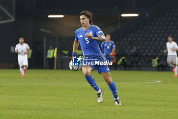 2024-10-14 - Riccardo Calafiori of Italy play the ball during Italy vs Israel, matchday 4 of League A of Uefa Nations League 2025, game at Bluenergy stadium - stadio Friuli in Udine (UD), Italy, on October 14, 2024. - ITALY VS ISRAEL - UEFA NATIONS LEAGUE - SOCCER