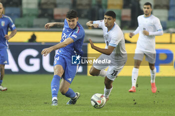 2024-10-14 - Alessandro Bastoni of Italy play the ball during Italy vs Israel, matchday 4 of League A of Uefa Nations League 2025, game at Bluenergy stadium - stadio Friuli in Udine (UD), Italy, on October 14, 2024. - ITALY VS ISRAEL - UEFA NATIONS LEAGUE - SOCCER