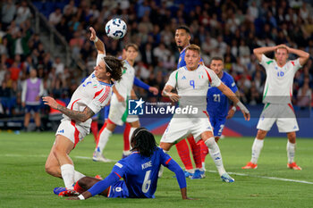 2024-09-06 - Riccardo Calafiori of Italy in action against Manu Kone of France - FRANCE VS ITALY - UEFA NATIONS LEAGUE - SOCCER