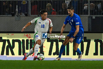 2024-09-09 - Giacomo Raspadori (Italy) in action against Idan Nachmias (Israel) during the UEFA Nations League match between Italy vs. Israele on 9th September 2024 at the Bozsik Arena stadium in Budapest, Hungary - ISRAEL VS ITALY - UEFA NATIONS LEAGUE - SOCCER