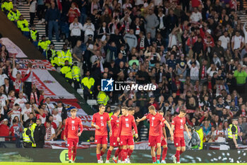 2024-09-05 - GOAL! 1-0 Poland players celebrate in front of their fan during the UEFA Nations League match between Scotland and Poland. The National Stadium, Hampden Park, Glasgow, Scotland. 05/09/2024. Photo Colin Poultney /ProSportsImages / DPPI - FOOTBALL - UEFA NATIONS LEAGUE - SCOTLAND V POLAND - UEFA NATIONS LEAGUE - SOCCER