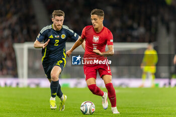 2024-09-05 - Kacper Urbański of Poland gets away from Anthony Ralston of Scotland during the UEFA Nations League match between Scotland and Poland. The National Stadium, Hampden Park, Glasgow, Scotland. 05/09/2024. Photo Colin Poultney /ProSportsImages / DPPI - FOOTBALL - UEFA NATIONS LEAGUE - SCOTLAND V POLAND - UEFA NATIONS LEAGUE - SOCCER