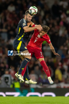 2024-09-05 - Grant Hanley of Scotland National Team & Kacper Urbański of Poland during the UEFA Nations League match between Scotland and Poland. The National Stadium, Hampden Park, Glasgow, Scotland. 05/09/2024. Photo Colin Poultney /ProSportsImages / DPPI - FOOTBALL - UEFA NATIONS LEAGUE - SCOTLAND V POLAND - UEFA NATIONS LEAGUE - SOCCER