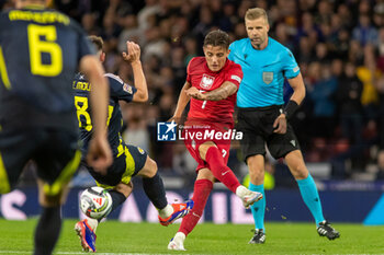 2024-09-05 - Billy Gilmour of Scotland National Team blocks a shot from Kacper Urbański of Poland during the UEFA Nations League match between Scotland and Poland. The National Stadium, Hampden Park, Glasgow, Scotland. 05/09/2024. Photo Colin Poultney /ProSportsImages / DPPI - FOOTBALL - UEFA NATIONS LEAGUE - SCOTLAND V POLAND - UEFA NATIONS LEAGUE - SOCCER