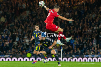 2024-09-05 - Robert Lewandowski of Poland wins a header against Grant Hanley of Scotland during the UEFA Nations League match between Scotland and Poland. The National Stadium, Hampden Park, Glasgow, Scotland. 05/09/2024. Photo Colin Poultney /ProSportsImages / DPPI - FOOTBALL - UEFA NATIONS LEAGUE - SCOTLAND V POLAND - UEFA NATIONS LEAGUE - SOCCER