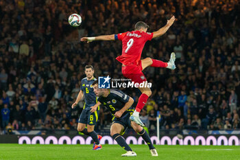 2024-09-05 - Robert Lewandowski of Poland wins a header against Grant Hanley of Scotland during the UEFA Nations League match between Scotland and Poland. The National Stadium, Hampden Park, Glasgow, Scotland. 05/09/2024. Photo Colin Poultney /ProSportsImages / DPPI - FOOTBALL - UEFA NATIONS LEAGUE - SCOTLAND V POLAND - UEFA NATIONS LEAGUE - SOCCER