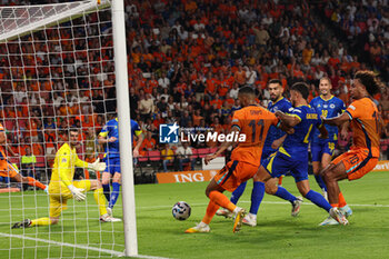 2024-09-07 - Cody Gakpo of Netherlands shoots to scores his first goal during the UEFA Nations League match between Netherlands and Bosnia & Herzegovina at Philips Stadion on September 7, 2024 in Eindhoven, Netherlands - FOOTBALL - NATIONS LEAGUE - NETHERLANDS V BOSNIA - UEFA NATIONS LEAGUE - SOCCER