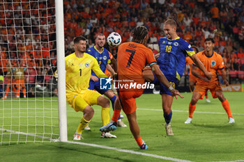 2024-09-07 - Xavi Simons of Netherlands shoots the ball during the UEFA Nations League match between Netherlands and Bosnia & Herzegovina at Philips Stadion on September 7, 2024 in Eindhoven, Netherlands - FOOTBALL - NATIONS LEAGUE - NETHERLANDS V BOSNIA - UEFA NATIONS LEAGUE - SOCCER