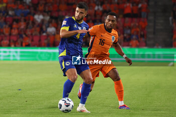 2024-09-07 - Quinten Timber of Netherlands battles for the ball with Jusuf Gazibegovic of Bosnia during the UEFA Nations League match between Netherlands and Bosnia & Herzegovina at Philips Stadion on September 7, 2024 in Eindhoven, Netherlands - FOOTBALL - NATIONS LEAGUE - NETHERLANDS V BOSNIA - UEFA NATIONS LEAGUE - SOCCER