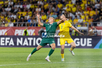 2024-09-09 - Radu Dragusin of Romania fighting for the ball with Armandas Kucys of Lithuania during the UEFA Nations League, Group stage, League C, Group C2, football match between Romania and Lithuania on 9 September 2024 at Stadionul Steaua in Bucharest, Romania - FOOTBALL - UEFA NATIONS LEAGUE - ROMANIA V LITHUANIA - UEFA NATIONS LEAGUE - SOCCER