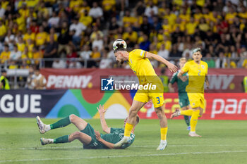 2024-09-09 - Radu Dragusin of Romania fighting for the ball with Armandas Kucys of Lithuania during the UEFA Nations League, Group stage, League C, Group C2, football match between Romania and Lithuania on 9 September 2024 at Stadionul Steaua in Bucharest, Romania - FOOTBALL - UEFA NATIONS LEAGUE - ROMANIA V LITHUANIA - UEFA NATIONS LEAGUE - SOCCER