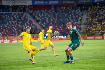 2024-09-09 - Andrei Ratiu of Romania and Artemijus Tutyskinas of Lithuania during the UEFA Nations League, Group stage, League C, Group C2, football match between Romania and Lithuania on 9 September 2024 at Stadionul Steaua in Bucharest, Romania - FOOTBALL - UEFA NATIONS LEAGUE - ROMANIA V LITHUANIA - UEFA NATIONS LEAGUE - SOCCER