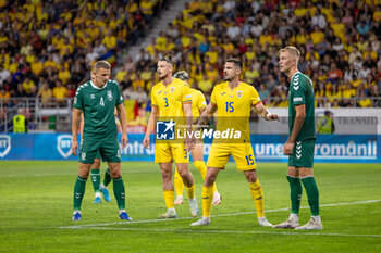 2024-09-09 - Edvinas Girdvainis of Lithuania, Radu Dragusin of Romania, Andrei Burca of Romania during the UEFA Nations League, Group stage, League C, Group C2, football match between Romania and Lithuania on 9 September 2024 at Stadionul Steaua in Bucharest, Romania - FOOTBALL - UEFA NATIONS LEAGUE - ROMANIA V LITHUANIA - UEFA NATIONS LEAGUE - SOCCER