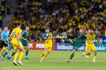 2024-09-09 - Andrei Ratiu of Romania fighting for the ball with Vykintas Slivka of Lithuania during the UEFA Nations League, Group stage, League C, Group C2, football match between Romania and Lithuania on 9 September 2024 at Stadionul Steaua in Bucharest, Romania - FOOTBALL - UEFA NATIONS LEAGUE - ROMANIA V LITHUANIA - UEFA NATIONS LEAGUE - SOCCER