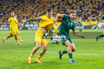 2024-09-09 - Dennis Man of Romania fighting for the ball with Artemijus Tutyskinas of Lithuania during the UEFA Nations League, Group stage, League C, Group C2, football match between Romania and Lithuania on 9 September 2024 at Stadionul Steaua in Bucharest, Romania - FOOTBALL - UEFA NATIONS LEAGUE - ROMANIA V LITHUANIA - UEFA NATIONS LEAGUE - SOCCER