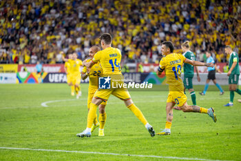 2024-09-09 - Ionut Mitrita of Romania scores his team's third goal to make the score 3-1 and celebrates with Ianis Hagi of Romania and Nicolae Stanciu of Romania during the UEFA Nations League, Group stage, League C, Group C2, football match between Romania and Lithuania on 9 September 2024 at Stadionul Steaua in Bucharest, Romania - FOOTBALL - UEFA NATIONS LEAGUE - ROMANIA V LITHUANIA - UEFA NATIONS LEAGUE - SOCCER