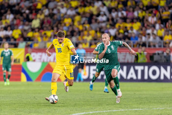 2024-09-09 - Razvan Marin of Romania and Modestas Vorobjovas of Lithuania fighting for the ball during the UEFA Nations League, Group stage, League C, Group C2, football match between Romania and Lithuania on 9 September 2024 at Stadionul Steaua in Bucharest, Romania - FOOTBALL - UEFA NATIONS LEAGUE - ROMANIA V LITHUANIA - UEFA NATIONS LEAGUE - SOCCER