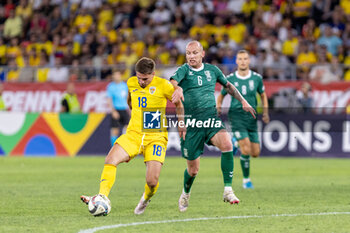 2024-09-09 - Razvan Marin of Romania and Modestas Vorobjovas of Lithuania fighting for the ball during the UEFA Nations League, Group stage, League C, Group C2, football match between Romania and Lithuania on 9 September 2024 at Stadionul Steaua in Bucharest, Romania - FOOTBALL - UEFA NATIONS LEAGUE - ROMANIA V LITHUANIA - UEFA NATIONS LEAGUE - SOCCER