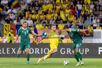 2024-09-09 - Denis Dragus of Romania, Giedrius Matulevicius of Lithuania and Rokas Lekiatas of Lithuania fighting for the ball during the UEFA Nations League, Group stage, League C, Group C2, football match between Romania and Lithuania on 9 September 2024 at Stadionul Steaua in Bucharest, Romania - FOOTBALL - UEFA NATIONS LEAGUE - ROMANIA V LITHUANIA - UEFA NATIONS LEAGUE - SOCCER