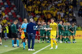 2024-09-09 - Ianis Hagi of Romania talking to Romania Manager, Mircea Lucescu, during the UEFA Nations League, Group stage, League C, Group C2, football match between Romania and Lithuania on 9 September 2024 at Stadionul Steaua in Bucharest, Romania - FOOTBALL - UEFA NATIONS LEAGUE - ROMANIA V LITHUANIA - UEFA NATIONS LEAGUE - SOCCER