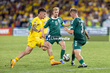 2024-09-09 - Dennis Man of Romania fighting for the ball with Justas Lasickas of Lithuania and Artemijus Tutyskinas of Lithuania during the UEFA Nations League, Group stage, League C, Group C2, football match between Romania and Lithuania on 9 September 2024 at Stadionul Steaua in Bucharest, Romania - FOOTBALL - UEFA NATIONS LEAGUE - ROMANIA V LITHUANIA - UEFA NATIONS LEAGUE - SOCCER