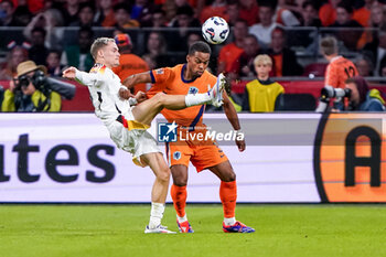 2024-09-10 - Florian Wirtz of Germany battles for the ball with Jurrien Timber of Netherlands during the UEFA Nations League 2024/2025 League A Group 3 match between Netherlands and Germany at Johan Cruijff ArenA on September 10, 2024 in Amsterdam, Netherlands. Photo Andre Weening/ Orange Pictures / DPPI - FOOTBALL - NATIONS LEAGUE - NETHERLANDS V GERMANY - UEFA NATIONS LEAGUE - SOCCER