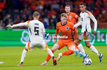 2024-09-10 - Jerdy Schouten of Netherlands is challenged by Pascal Gross of Germany during the UEFA Nations League 2024/2025 League A Group 3 match between Netherlands and Germany at Johan Cruijff ArenA on September 10, 2024 in Amsterdam, Netherlands. Photo Andre Weening/ Orange Pictures / DPPI - FOOTBALL - NATIONS LEAGUE - NETHERLANDS V GERMANY - UEFA NATIONS LEAGUE - SOCCER