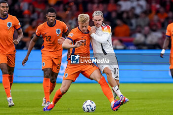 2024-09-10 - Jan-Paul van Hecke of Netherlands battles for the ball with Florian Wirtz of Germany during the UEFA Nations League 2024/2025 League A Group 3 match between Netherlands and Germany at Johan Cruijff ArenA on September 10, 2024 in Amsterdam, Netherlands. Photo Andre Weening/ Orange Pictures / DPPI - FOOTBALL - NATIONS LEAGUE - NETHERLANDS V GERMANY - UEFA NATIONS LEAGUE - SOCCER