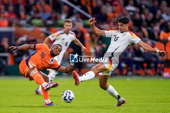 2024-09-10 - Quinten Timber of Netherlands battles for the ball with Nico Schlotterbeck of Germany during the UEFA Nations League 2024/2025 League A Group 3 match between Netherlands and Germany at Johan Cruijff ArenA on September 10, 2024 in Amsterdam, Netherlands. Photo Andre Weening/ Orange Pictures / DPPI - FOOTBALL - NATIONS LEAGUE - NETHERLANDS V GERMANY - UEFA NATIONS LEAGUE - SOCCER