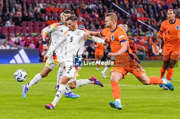 2024-09-10 - Pascal Gross of Germany battles for the ball with Matthijs De Ligt of Netherlands during the UEFA Nations League 2024/2025 League A Group 3 match between Netherlands and Germany at Johan Cruijff ArenA on September 10, 2024 in Amsterdam, Netherlands. Photo Andre Weening/ Orange Pictures / DPPI - FOOTBALL - NATIONS LEAGUE - NETHERLANDS V GERMANY - UEFA NATIONS LEAGUE - SOCCER