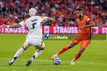 2024-09-10 - Cody Gakpo of Netherlands is challenged by Pascal Gross of Germany during the UEFA Nations League 2024/2025 League A Group 3 match between Netherlands and Germany at Johan Cruijff ArenA on September 10, 2024 in Amsterdam, Netherlands. Photo Andre Weening/ Orange Pictures / DPPI - FOOTBALL - NATIONS LEAGUE - NETHERLANDS V GERMANY - UEFA NATIONS LEAGUE - SOCCER