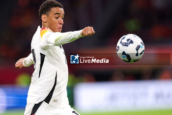 2024-09-10 - Jamal Musiala of Germany kicks the ball during the UEFA Nations League 2024/2025 League A Group 3 match between Netherlands and Germany at Johan Cruijff ArenA on September 10, 2024 in Amsterdam, Netherlands. Photo Peter Lous/ Orange Pictures / DPPI - FOOTBALL - NATIONS LEAGUE - NETHERLANDS V GERMANY - UEFA NATIONS LEAGUE - SOCCER