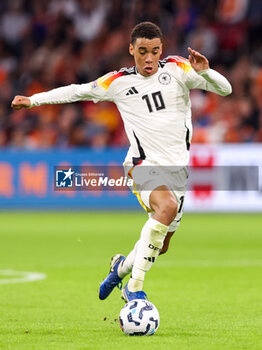 2024-09-10 - Jamal Musiala of Germany runs with the ball during the UEFA Nations League 2024/2025 League A Group 3 match between Netherlands and Germany at Johan Cruijff ArenA on September 10, 2024 in Amsterdam, Netherlands. Photo Peter Lous/ Orange Pictures / DPPI - FOOTBALL - NATIONS LEAGUE - NETHERLANDS V GERMANY - UEFA NATIONS LEAGUE - SOCCER