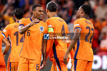 2024-09-10 - Ryan Gravenberch of the Netherlands, Virgil van Dijk of the Netherlands, Denzel Dumfries of the Netherlands celebrates after scoring his teams second goal during the UEFA Nations League 2024/2025 League A Group 3 match between Netherlands and Germany at Johan Cruijff ArenA on September 10, 2024 in Amsterdam, Netherlands. Photo Peter Lous/ Orange Pictures / DPPI - FOOTBALL - NATIONS LEAGUE - NETHERLANDS V GERMANY - UEFA NATIONS LEAGUE - SOCCER