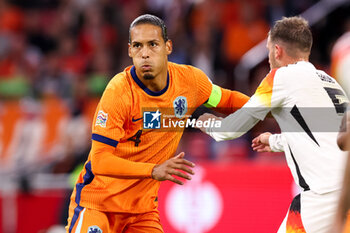 2024-09-10 - Virgil van Dijk of the Netherlands battles for possession with Pascal Gross of Germany during the UEFA Nations League 2024/2025 League A Group 3 match between Netherlands and Germany at Johan Cruijff ArenA on September 10, 2024 in Amsterdam, Netherlands. Photo Peter Lous/ Orange Pictures / DPPI - FOOTBALL - NATIONS LEAGUE - NETHERLANDS V GERMANY - UEFA NATIONS LEAGUE - SOCCER