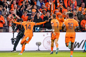 2024-09-10 - Tijjani Reijnders of Netherlands celebrates after scoring his sides first goal with Xavi Simons of Netherlands during the UEFA Nations League 2024/2025 League A Group 3 match between Netherlands and Germany at Johan Cruijff ArenA on September 10, 2024 in Amsterdam, Netherlands. Photo Andre Weening/ Orange Pictures / DPPI - FOOTBALL - NATIONS LEAGUE - NETHERLANDS V GERMANY - UEFA NATIONS LEAGUE - SOCCER