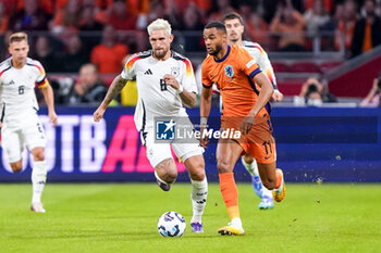 2024-09-10 - Cody Gakpo of Netherlands is challenged by Robert Andrich of Germany during the UEFA Nations League 2024/2025 League A Group 3 match between Netherlands and Germany at Johan Cruijff ArenA on September 10, 2024 in Amsterdam, Netherlands. Photo Andre Weening/ Orange Pictures / DPPI - FOOTBALL - NATIONS LEAGUE - NETHERLANDS V GERMANY - UEFA NATIONS LEAGUE - SOCCER