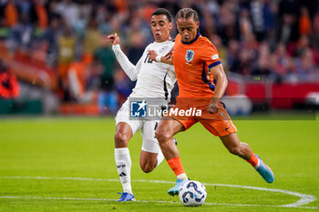 2024-09-10 - Xavi Simons of Netherlands is challenged by Jamal Musiala of Germany during the UEFA Nations League 2024/2025 League A Group 3 match between Netherlands and Germany at Johan Cruijff ArenA on September 10, 2024 in Amsterdam, Netherlands. Photo Andre Weening/ Orange Pictures / DPPI - FOOTBALL - NATIONS LEAGUE - NETHERLANDS V GERMANY - UEFA NATIONS LEAGUE - SOCCER