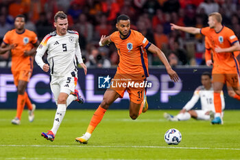 2024-09-10 - Cody Gakpo of Netherlands is challenged by Pascal Gross of Germany during the UEFA Nations League 2024/2025 League A Group 3 match between Netherlands and Germany at Johan Cruijff ArenA on September 10, 2024 in Amsterdam, Netherlands. Photo Andre Weening/ Orange Pictures / DPPI - FOOTBALL - NATIONS LEAGUE - NETHERLANDS V GERMANY - UEFA NATIONS LEAGUE - SOCCER