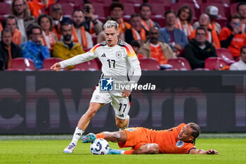 2024-09-10 - Xavi Simons of Netherlands battles for the ball with Florian Wirtz of Germany during the UEFA Nations League 2024/2025 League A Group 3 match between Netherlands and Germany at Johan Cruijff ArenA on September 10, 2024 in Amsterdam, Netherlands. Photo Andre Weening/ Orange Pictures / DPPI - FOOTBALL - NATIONS LEAGUE - NETHERLANDS V GERMANY - UEFA NATIONS LEAGUE - SOCCER