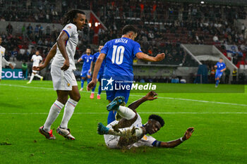 2024-10-10 - Aurelien Djani Tchouameni (France) in action against Christopher Nkunku (France) during the UEFA Nations League match between Israel vs. France on 10th October 2024 at the Bozsik Arena stadium in Budapest, Hungary - ISRAEL VS FRANCE - UEFA NATIONS LEAGUE - SOCCER