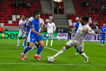 2024-10-10 - Michael Olise (France) in action against Oscar Gloukh (Israel) during the UEFA Nations League match between Israel vs. France on 10th October 2024 at the Bozsik Arena stadium in Budapest, Hungary - ISRAEL VS FRANCE - UEFA NATIONS LEAGUE - SOCCER