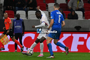 2024-10-10 - Randal Kolo Muani (France) in action against Idan Nachmias (Israel) during the UEFA Nations League match between Israel vs. France on 10th October 2024 at the Bozsik Arena stadium in Budapest, Hungary - ISRAEL VS FRANCE - UEFA NATIONS LEAGUE - SOCCER