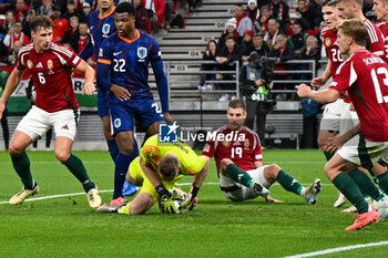 2024-10-11 - 1 Denes Dibusz (Hungary) saves the ball on free kick in the area during the UEFA Nations League match between Hungary vs. Holland on 11th October 2024 at the Puskas Arena stadium in Budapest, Hungary - HUNGARY VS NETHERLANDS - UEFA NATIONS LEAGUE - SOCCER