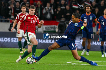 2024-10-11 - Clash between Roland Sallai (Hungary) and Virgil van Dijk (Netherlands) during the UEFA Nations League match between Hungary vs. Holland on 11th October 2024 at the Puskas Arena stadium in Budapest, Hungary - HUNGARY VS NETHERLANDS - UEFA NATIONS LEAGUE - SOCCER