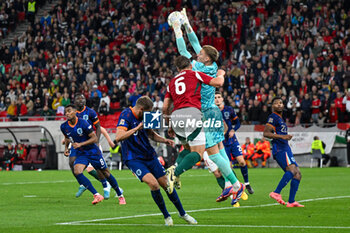 2024-10-11 - Bart Verbruggen (Netherlands) saves the ball against Willi Orban (Hungary) during the UEFA Nations League match between Hungary vs. Holland on 11th October 2024 at the Puskas Arena stadium in Budapest, Hungary - HUNGARY VS NETHERLANDS - UEFA NATIONS LEAGUE - SOCCER