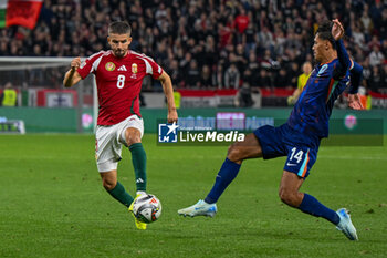 2024-10-11 - Adam Nagy (Hungary) in action against Tijjani Reijnders (Netherlands) during the UEFA Nations League match between Hungary vs. Holland on 11th October 2024 at the Puskas Arena stadium in Budapest, Hungary - HUNGARY VS NETHERLANDS - UEFA NATIONS LEAGUE - SOCCER