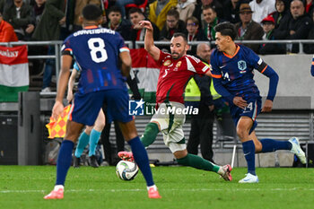 2024-10-11 - Attila Fiola (Hungary) in action against Virgil van Dijk (Netherlands) during the UEFA Nations League match between Hungary vs. Holland on 11th October 2024 at the Puskas Arena stadium in Budapest, Hungary - HUNGARY VS NETHERLANDS - UEFA NATIONS LEAGUE - SOCCER